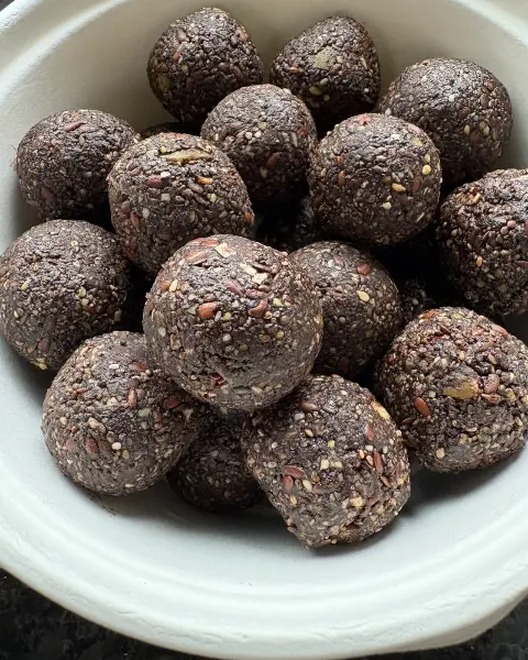A bowl of Dark Eight laddus, freshly rolled
